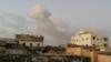 Smoke rises after car bombs explode in Mogadishu, Somalia, Feb. 23, 2018, in this still image taken from social media video.