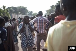 FILE - Residents of the PK5, a Muslim-majority district, demonstrate in front of the headquarters of MINUSCA, the UN peacekeeping mission in Central Africa Republic, following clashes in Bangui, on April 11, 2018.
