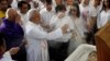 FILE - A priest performs last rites during the funeral mass for Filipino Mayor Antonio Cando Halili, who was assassinated while attending a flag ceremony last Monday, in Tanauan, Batangas, in Philippines, July 8, 2018. 