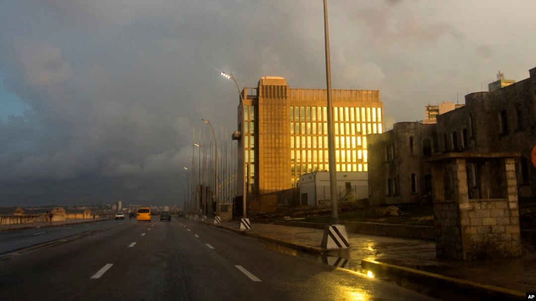 FILE - Rays from the setting sun shine on the facade of the United States Embassy, in Havana, Cuba, Oct. 14, 2017.