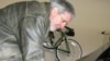 Volt owner Jeff Parmet disconnects the power cord from his new electric car.