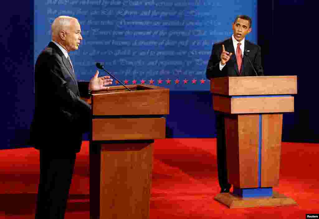Republican presidential candidate John McCain (L) and Democratic presidential candidate Barack Obama (R) take part in their first 2008 presidential debate at the University of Mississippi in Oxford, Mississippi, Sept. 26, 2008.