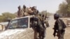 FILE - Cameroon soldiers check a truck on the border between Cameroon and Nigeria as they combat militants, including Boko Haram, Feb. 19, 2015.