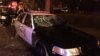 A police car with broken windows is seen in this photograph released by the Milwaukee Police Department after disturbances following the police shooting of a man in Milwaukee, Wisconsin, Aug. 13, 2016.