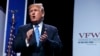 President Donald Trump walks off after speaking to the Veterans of Foreign Wars of the United States National Convention, in Kansas City, Missouri. 