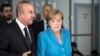Turkish Foreign Minister Mevlut Cavusoglu talks with German Chancellor Angela Merkel in Duesseldorf, western Germany, May 29, 2018. 