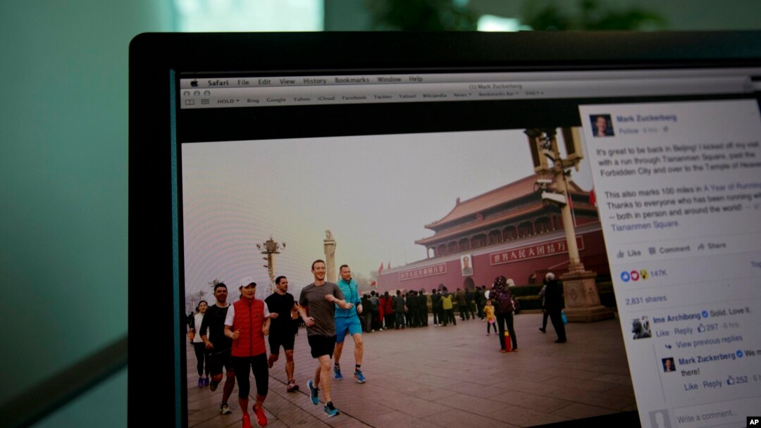 A computer screen displays the social media posting by Mark Zuckerberg on Facebook in Beijing, China, Friday, March 18, 2016.