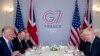 President Donald Trump and Britain's Prime Minister Boris Johnson, right, attend a working breakfast at the Hotel du Palais on the sidelines of the G-7 summit in Biarritz, France, Aug. 25, 2019. 