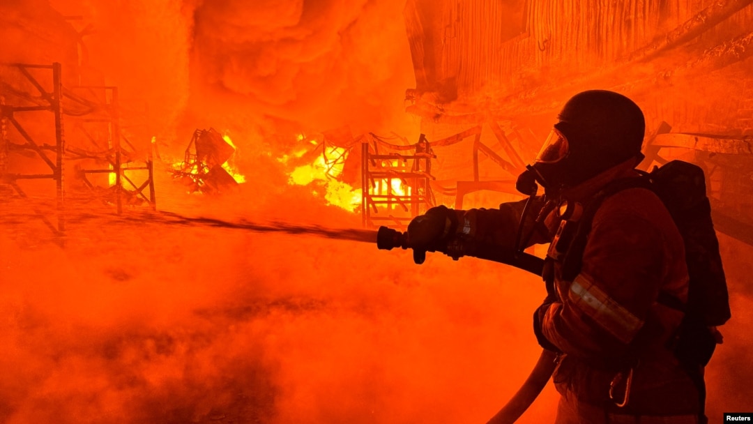 A firefighter works at a site of a Russian drone strike in Kharkiv, Ukraine, on May 4, 2024.