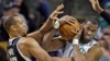 Boston Celtics center Jason Collins (r) struggles for control of the ball with Sacramento Kings' forward Chuck Hayes (42) during the second half of an NBA basketball game in Boston, Jan. 30, 2013. 