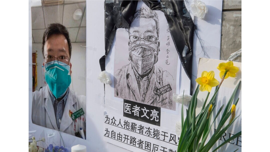 Chinese students and their supporters hold a memorial for Dr. Li Wenliang, who was the whistle-blower of COVID-19, outside the UCLA campus in Westwood, Calif., Feb. 15, 2020.