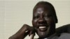 Former NBA star Manute Bol poses for a photograph at the Sunrise Sudan headquarters June 9, 2008, in Lenexa, Kansas.