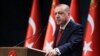 FILE - Turkey's President Recep Tayyip Erdogan announces early presidential and parliamentary elections for June 24, 2018, at the Presidential Palace, in Ankara, Turkey, April 18, 2018. 