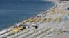 FILE - Tourists enjoy a beach in the Mediterranean resort city of Antalya, a popular destination for German tourists, in Turkey, July 25, 2016.