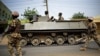 FILE - Nigerian troops patrol in the northeastern Nigeria city of Mubi — recaptured from Boko Haram in February — 20 kilometers (14 miles) west of the Cameroon border, March 9, 2015.
