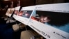 FILE - Facebook ads linked to a Russian effort to disrupt the American political process are displayed as Google, Facebook and Twitter officials testify during a House Intelligence Committee hearing on Capitol Hill in Washington, Nov. 1, 2017. Now Britain is threatening Facebook and Twitter with consequences over Russia's use of the platforms in the run-up to last year's Brexit referendum.