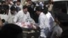 Hospital staff assist Malala Yousufzai, a 14-year-old schoolgirl who was wounded in a gun attack, at Saidu Sharif Teaching Hospital in the Swat Valley region in northwest Pakistan, October 9, 2012.