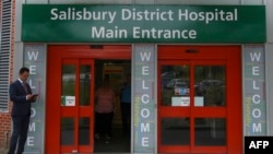 FILE - A general view shows the main entrance to Salisbury District Hospital, in Salisbury, southern England, July 04, 2018, where a British woman, Dawn Sturgess, poisoned with a nerve agent, died Sunday. 