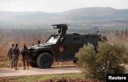Members of Turkish police special forces are seen near Mount Barsaya in Qastal village, Azaz city, Syria, Feb. 1, 2018.