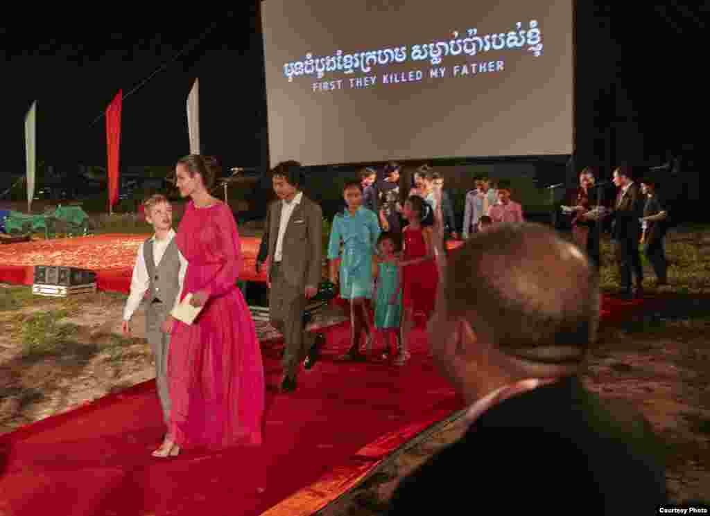 American actress Angelina Jolie, her Cambodian-born son Maddox and other children, arrive at an outdoor world premiere of "First They Killed My Father" near Angkor Wat in Siem Reap, Cambodia, February 18, 2017. (Amanda Boury/Netflix)