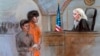This courtroom sketch depicts Boston Marathon bombing suspect Dzhokhar Tsarnaev standing with his lawyer Judy Clarke (L) before Magistrate Judge Marianne Bowler (R) during his arraignment in federal court in Boston, July 10, 2013.