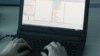 FILE - A laptop shows part of a code, which is the component of Petya malware computer virus, according to representatives of Ukrainian cybersecurity firm ISSP, at the firm's office in Kyiv, Ukraine, July 4, 2017. 