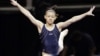 Kyla Ross leaps from the balance beam during practice for the U.S. Olympic gymnastics trials, June 27, 2012, in San Jose, California.