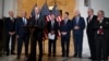Republican Senator Rob Portman, center, standing with with other senators, speaks during a news conference on Capitol Hill in Washington, Jan. 19, 2022.