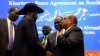 South Sudan President Salva Kiir, Sudan's President Omar Al-Bashir and South Sudan rebel leader Riek Machar talk after signing a peace agreement aimed to end a war in which tens of thousands of people have been killed, in Khartoum, Sudan, June 27, 2018. 