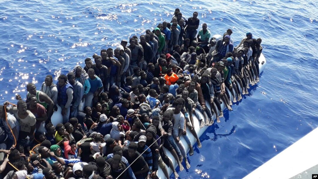 This Sunday, June 24, 2018 photo released by the Libyan Coast Guard shows migrants on a ship intercepted offshore near the town of Gohneima, east of the capital, Tripoli. 