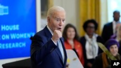 President Joe Biden speaks about the White House Initiative on Women's Health Research, from the East Room of the White House in Washington, Dec. 11, 2024. 