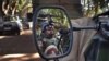 A French soldier is reflected in the mirror of a military jeep in Niono, Mali, January 20, 2013.