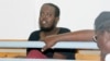FILE - Hassan Hanafi Haji sits inside Mogadishu's military court during a hearing on the killings of Somali journalists, in Mogadishu, Somalia, March, 3, 2016. 