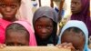 FILE - Displaced children attend class in Dori, Burkina Faso, Aug. 7, 2021. The Norwegian Refugee Council said Burkina Faso’s slow, insufficient humanitarian response to the country’s escalating attacks was forcing people to choose between violence and hunger.