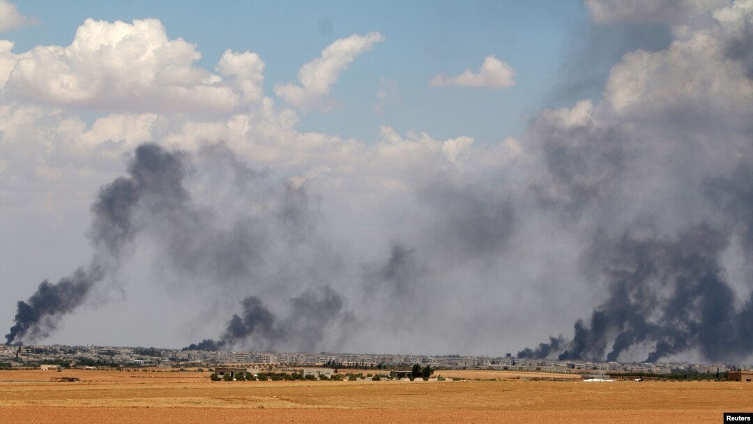 Smoke rises from Manbij city, Aleppo province, Syria, June 8, 2016. French special forces in northern Syria are assisting Kurdish-led militias in a drive to retake a pocket of territory west of the Euphrates River from the Islamic State terror group, according to French officials.