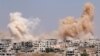 Smoke rises after airstrikes on a rebel-held part of the southern city of Daraa, Syria, June 15, 2017. 