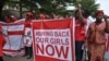 Scores of protesters marched chanting "Bring Back Our Girls" kidnapped six months ago by Boko Haram.