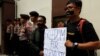 FILE - Journalists take part in a protest against the recent imprisonment by Myanmar authorities of Reuters journalists Wa Lone, 32, and Kyaw Soe Oo, 28, outside the Myanmar embassy in Jakarta, Indonesia, Sept. 7, 2018. 