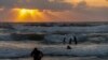 Families gather on the beaches of Alexandria, Egypt, on July 25, 2021. (Hamada Elrasam/VOA) 