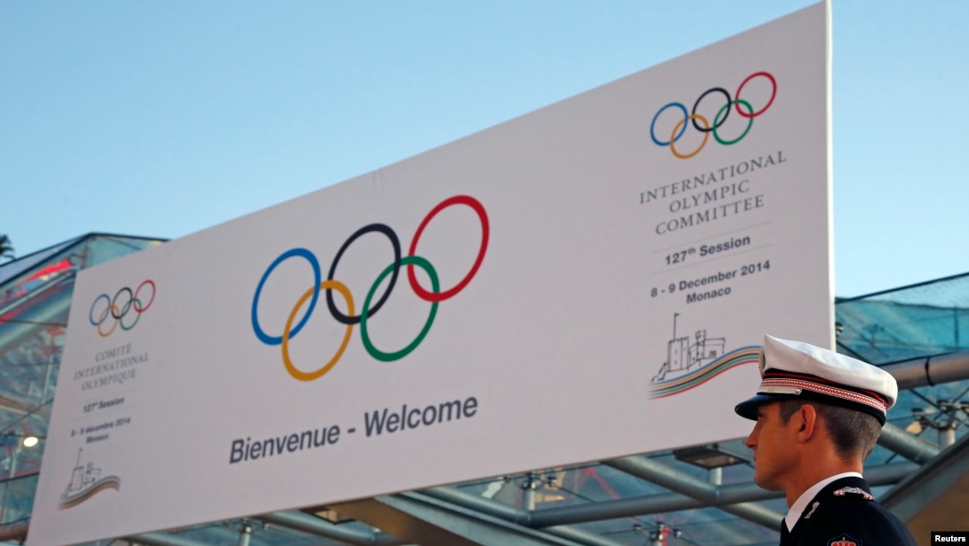 A Monaco policeman stands in front of the Grimaldi Forum during the opening of the 127th International Olympic Committee (IOC) session in Monaco, Dec. 8, 2014. 