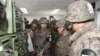 최윤희 한국 합참의장이 18일 동부전선 최전방 일반전초(GOP) 부대를 방문해 한국 군이 가동 중인 대북 확성기 방송 시설을 살펴보고 있다. 
