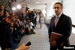 FILE - Michael Cohen, personal attorney for U.S. President Donald Trump, talks to reporters after meeting with Senate Intelligence Committee staff as the panel investigates alleged Russian interference in the 2016 U.S. presidential election, in Washington, Sept. 19, 2017.