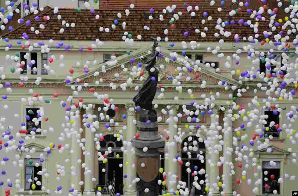 Members of Sao Paulo's Commerce Association release fifty thousand balloons to celebrate the New Year in Sao Paulo, Brazil.