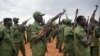South Sudanese rebel soldiers raise their weapons at a military camp in the capital Juba, South Sudan, Thursday, April 7, 2016.
