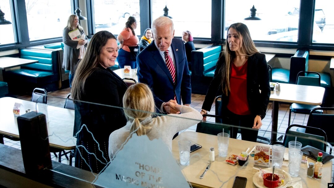 Democratic presidential candidate former Vice President Joe Biden greets guests at Ross' Restaurant, Jan. 6, 2020, in Bettendorf, Iowa.