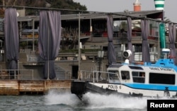 A Turkish coast guard boat patrols in front of the Reina nightclub by the Bosphorus, which was attacked by a gunman, in Istanbul, Jan. 1, 2017.