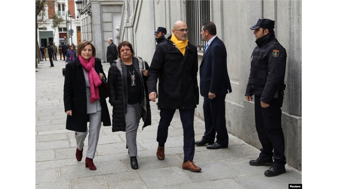 Catalan politicians (L-R) Carme Forcadell, Dolors Bassa and Raul Romeva arrive together to the Supreme Court after being summoned and facing investigation for their part in Catalonia's bid for independence in Madrid, Spain, March 23, 2018.