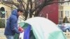 Jesse Sullivan has been camping out in the cold near a busy intersection in Washington to raise awareness for people in Haiti
