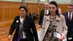 Cindy Kiro, left, and Prime Minister Jacinda Ardern, right, walk together through Parliament Building, May 24, 2021, in Wellington, New Zealand.