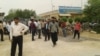 Farmers from the town of Bavi in southwestern Iran's Khuzestan province rally outside a municipal building in Ahvaz to protest water shortages, April 23, 2018 .